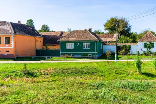 Typical rural landscape and rustic houses in Barcut -Bekokten, Transylvania, Romania, 2021.