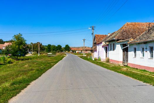 Typical rural landscape and rustic houses in Barcut -Bekokten, Transylvania, Romania, 2021.
