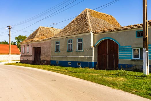 Typical rural landscape and rustic houses in Barcut -Bekokten, Transylvania, Romania, 2021.