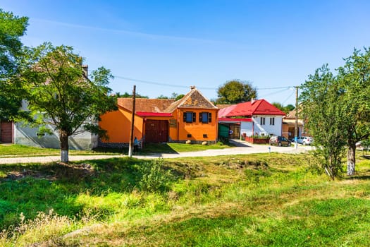 Typical rural landscape and rustic houses in Barcut -Bekokten, Transylvania, Romania, 2021.