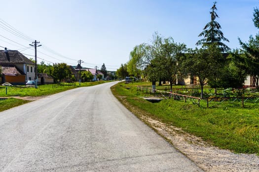 Typical rural landscape and rustic houses in Barcut -Bekokten, Transylvania, Romania, 2021.