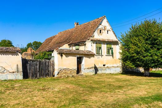 Typical rural landscape and rustic houses in Barcut -Bekokten, Transylvania, Romania, 2021.