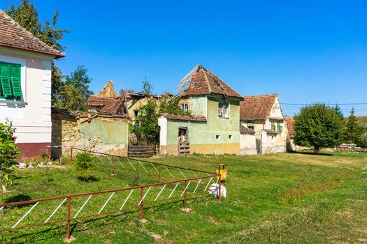 Typical rural landscape and rustic houses in Barcut -Bekokten, Transylvania, Romania, 2021.