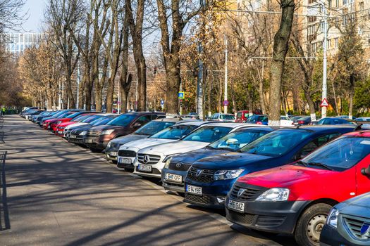 Parked cars along the street. Bucharest, Romania, 2021