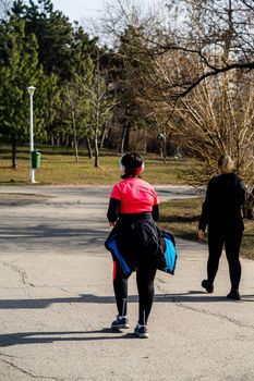 Jogging, running in the city park. Healthy lifestyle, outdoor physical activity and fitness concept in Bucharest, Romania, 2021