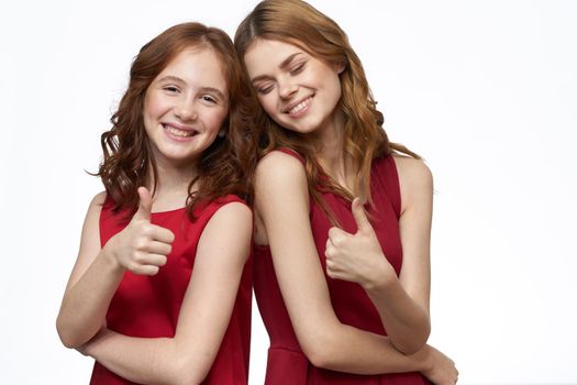 Joyful family fun mom daughter emotions light background. High quality photo