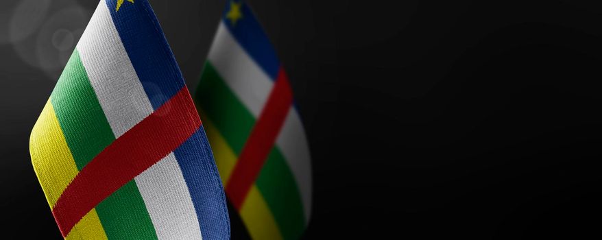 Small national flags of the Central African Republic on a dark background.