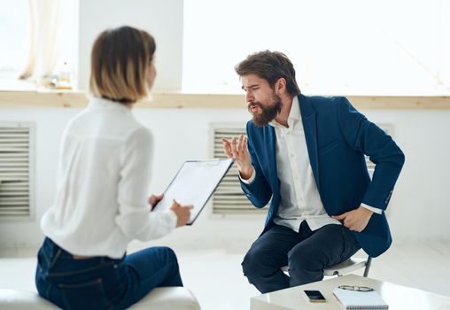 A man in a suit at a psychologist's office near the window. High quality photo