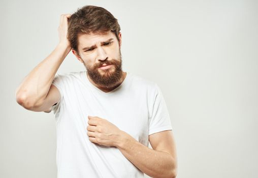 The guy gestures with his hands a puzzled look of emotion of bewilderment. High quality photo