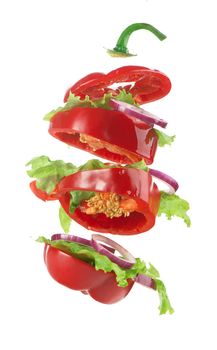 Creative layout made of tomato, bell pepper, cucumber and salad leaves mix