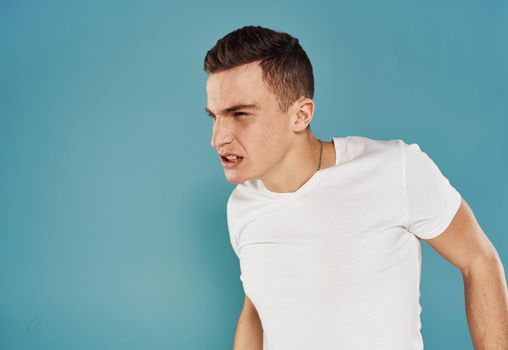 portrait of emotional man on blue background cropped view Copy Spac. High quality photo