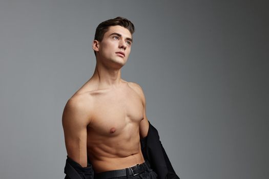 handsome man naked torso black shirt cuteness posing model. High quality photo