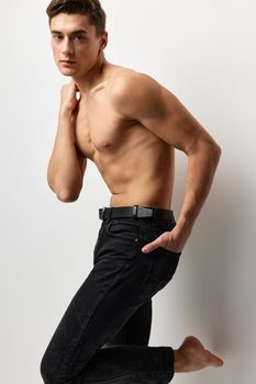 male topless black jeans posing fashion self confidence. High quality photo