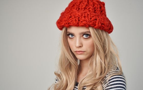 looking sexy blondes in red knitted hat and striped t-shirt cropped view close-up. High quality photo