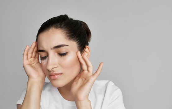 woman in white t-shirt cropped view health problem headache. High quality photo