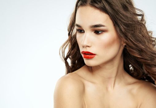 Beautiful lady red lips curly hair makeup portrait. High quality photo
