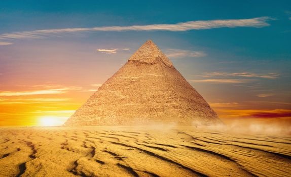 Egyptian pyramids in sand desert and clear sky