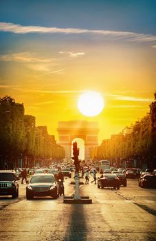 Beautiful cloudy sunset over Arc de Triomphe in Paris, France