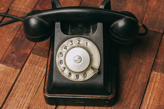 retro telephone nostalgia old technology communication wooden background. High quality photo