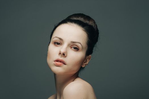 brunette bare shoulders gathered head hair glamor glamor. High quality photo