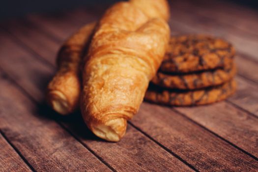sweet pastries and desserts tea party wooden table breakfast snack. High quality photo