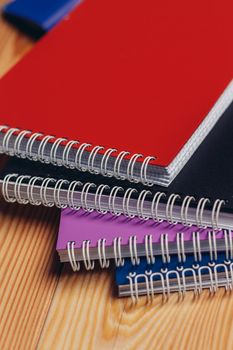 multicolored notepads office desk paper documents close-up. High quality photo