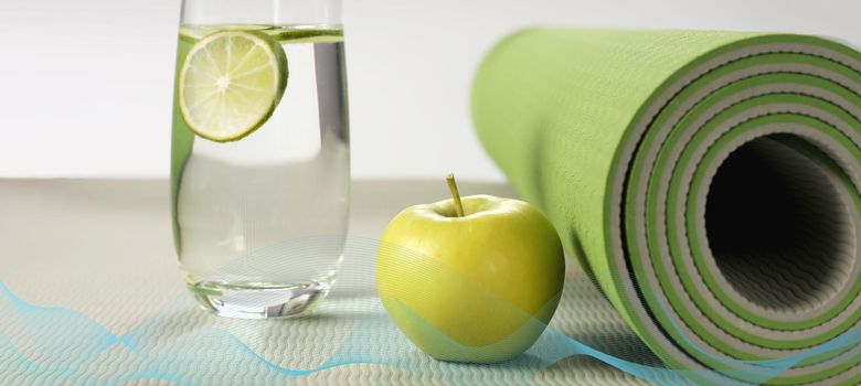 Yoga fitness, health life style. Yoga rolled mat, apple, glass of water with lemon, abstract wave. Place for text. Healthy lifestyle, fitness, sport concept