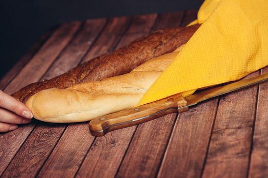 sliced loaf yellow napkin wooden table baked goods. High quality photo