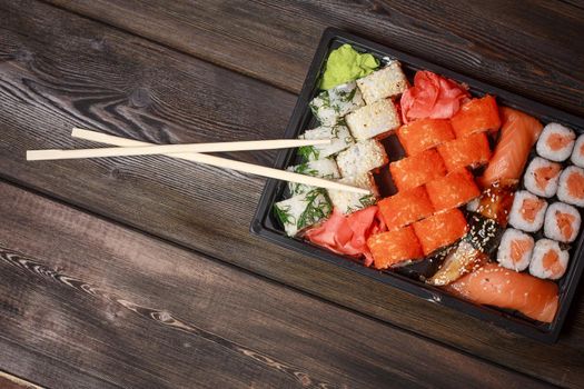 seafood sushi rolls wooden sticks japanese tradition ginger wasabi. High quality photo