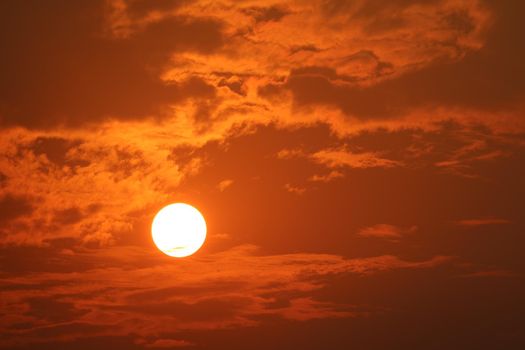 beautiful sunset orange yellow and dark red flame color of sky back on the cloud