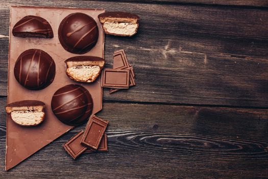 Marshmallow on chocolate sweets delicacy cocoa wooden table. High quality photo