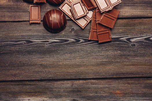 sweets chocolate cakes on a wooden table top view. High quality photo