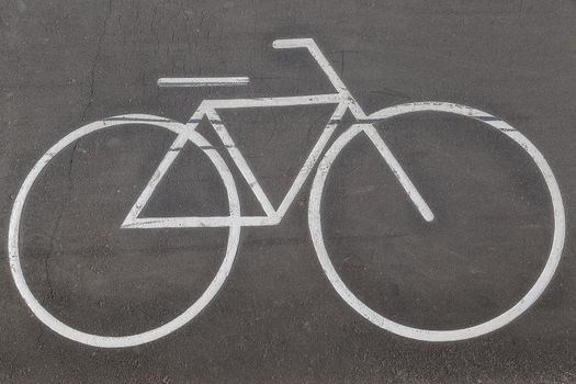 Bicycle sign on the road. Road markings, bike lane indication, friendly urban environment concept.