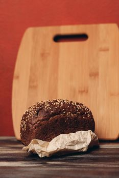 rye bread on a paper stand and a blackboard in the background. High quality photo