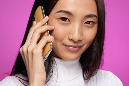 pretty brunette talking on the phone internet technology lifestyle. High quality photo