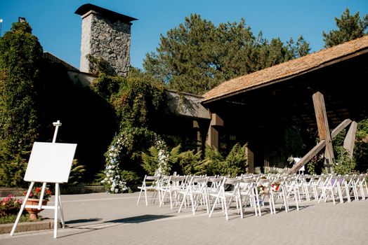 wedding ceremony in the woods among the trees on the green track