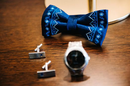 wedding ring in a box and watch the groom on the table