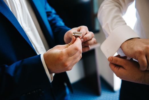 the bride and groom tenderly hold hands between them love and relationships