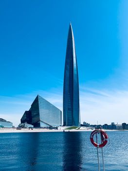 Russia, St.Petersburg, 26 May 2020: The skyscraper Lakhta center through a lifebuoy at day time, It is the highest skyscraper in Europe, completion of construction, sunny weather