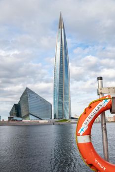 Russia, St.Petersburg, 06 July 2020: The skyscraper Lakhta center through a lifebuoy at day time, It is the highest skyscraper in Europe, completion of construction, sunny weather