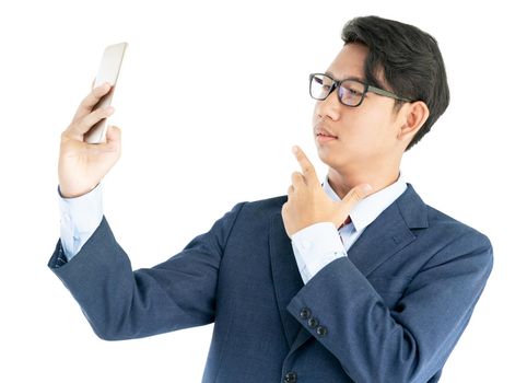 Young asian business men portrait in suit  holding smartphone against white background