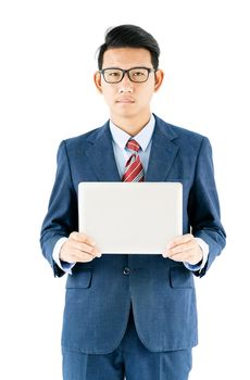 Young asian businessman portrait in suit and wear glasses holding a laptop over white background