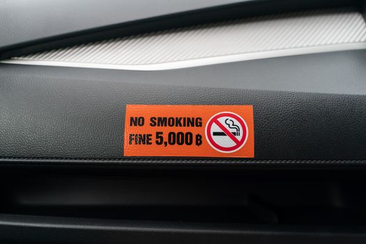 Label No smoking in the car, no smoking in the public vehicle and Taxi.
