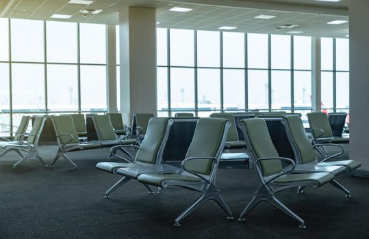 Empty chairs in departure lounge or terminal at the airport.