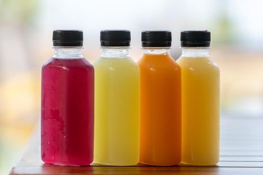 Healthy smoothies fruit and vegetable juice in bottles.