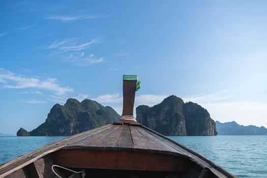 Head of wooden long tailed boat tour heading to beautiful Islands. Thailand Journey boat trip concept.