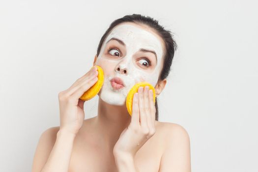 brunette with face mask naked shoulders skincare. High quality photo