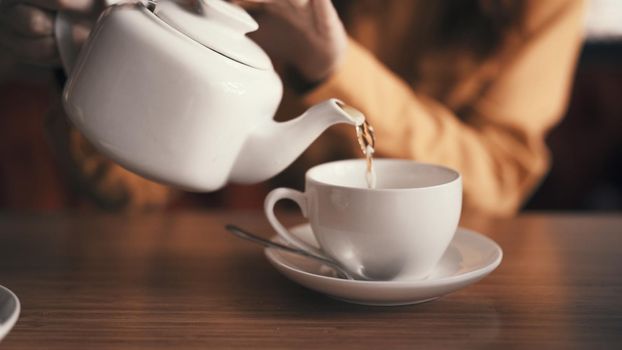 tea in a teapot mug on the table cafe breakfast How to rest. High quality photo