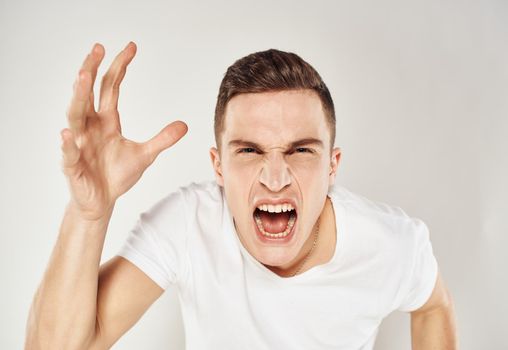 Aggressive man gestures with his hands nervousness madness model. High quality photo