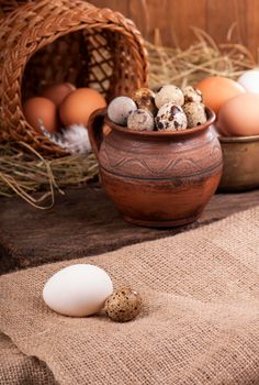 eggs in basket on grey wooden background